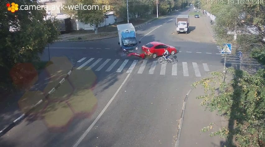 Russian Cyclist Hit by Truck – Escapes Injury